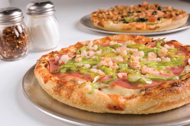 Towne menu photograph of a pizza topped with ham, green peppers and mushrooms